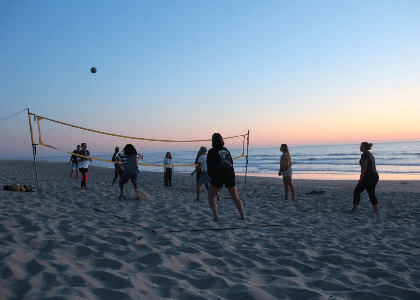 Playing Volleyball at sunset at I Surf Portugal